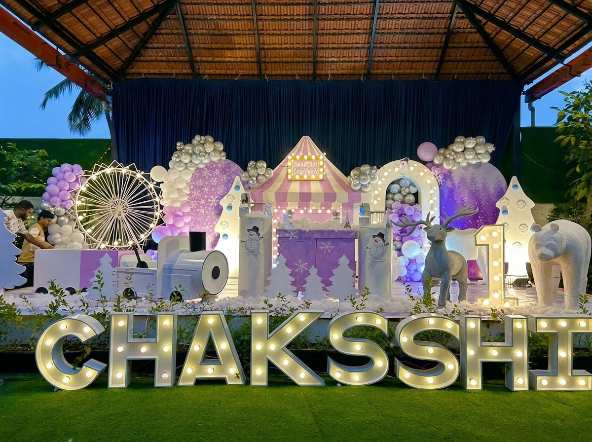 Winter carnival birthday setup with marquee letters and ferris wheel